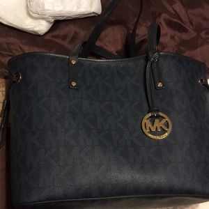 A MK tote and reversible